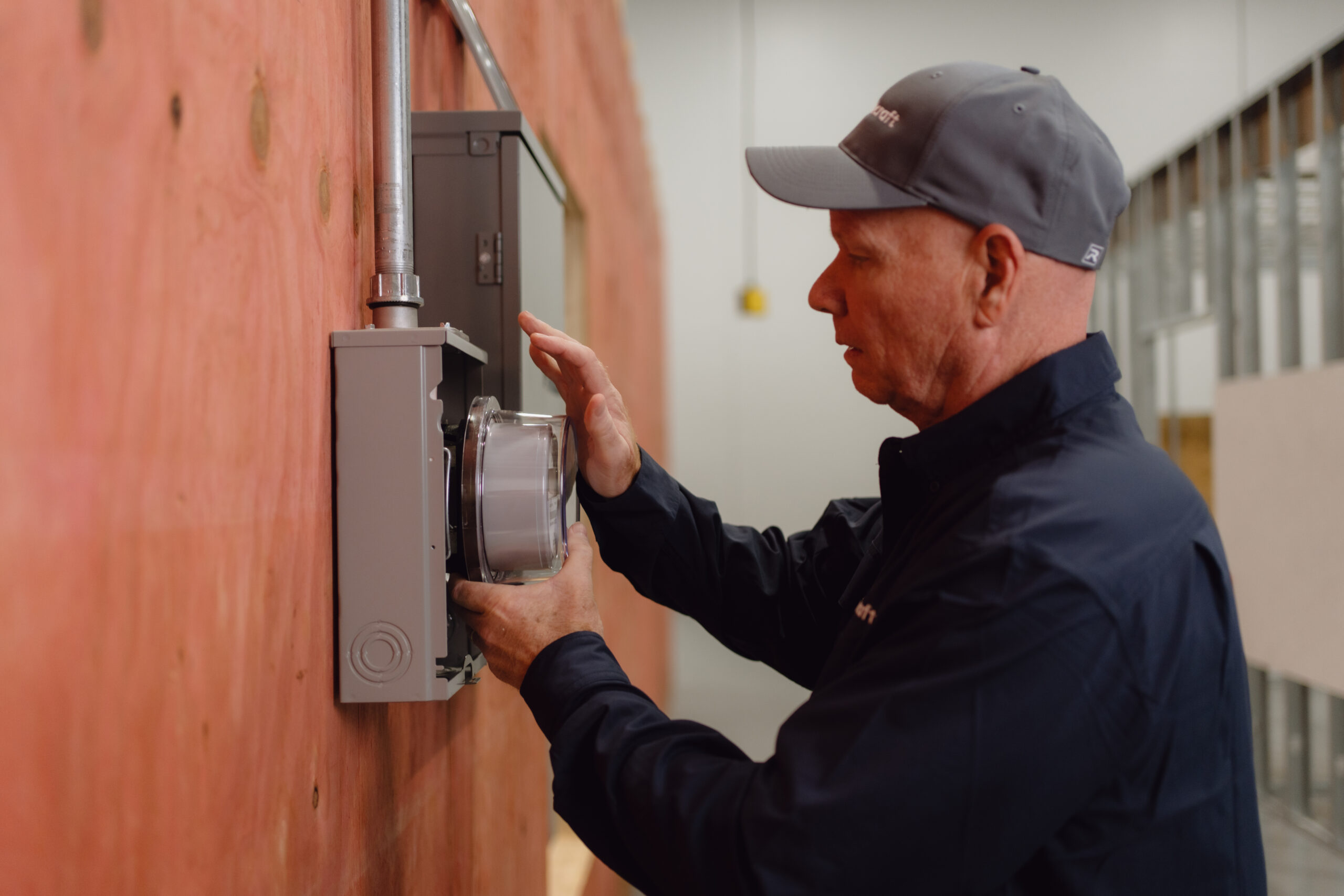 Electrician wiring an electrical panel