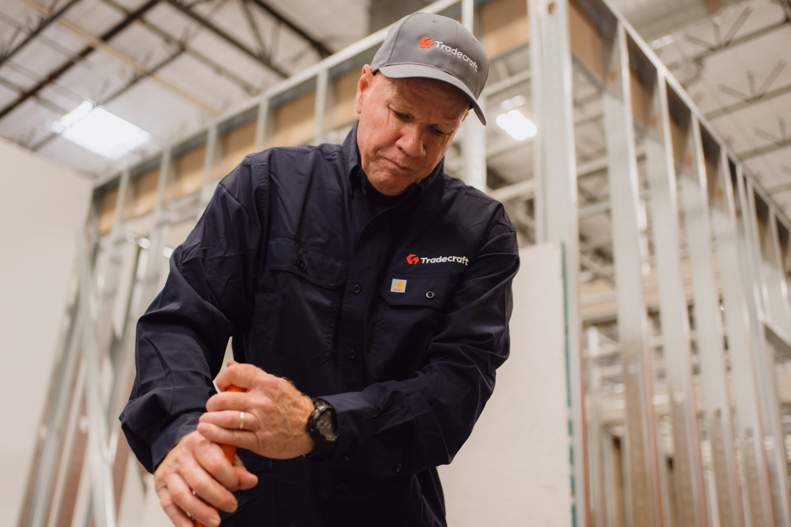 Tradecraft students on-site learning electrical and plumbing skills