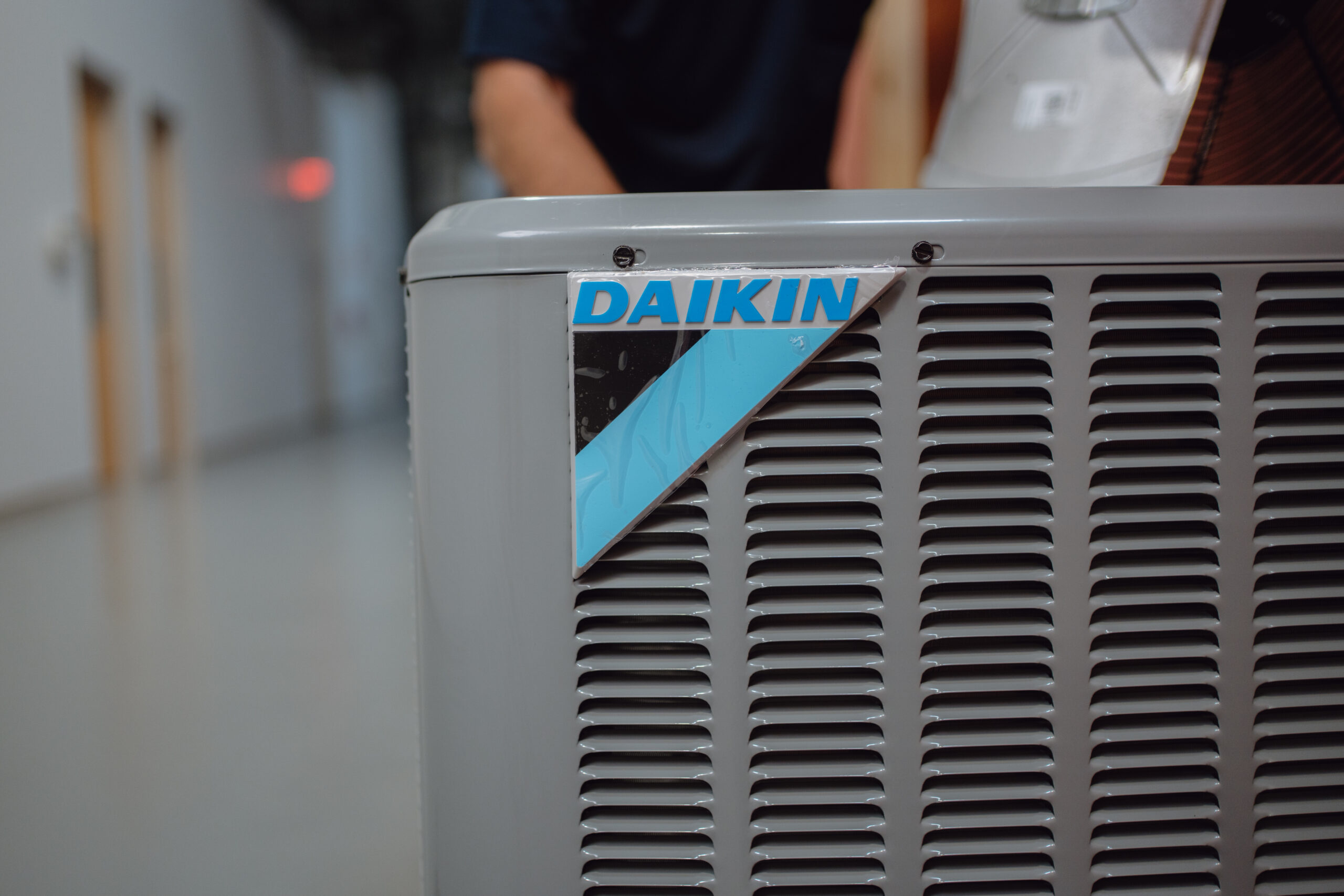HVAC technician servicing equipment at Tradecraft Schools