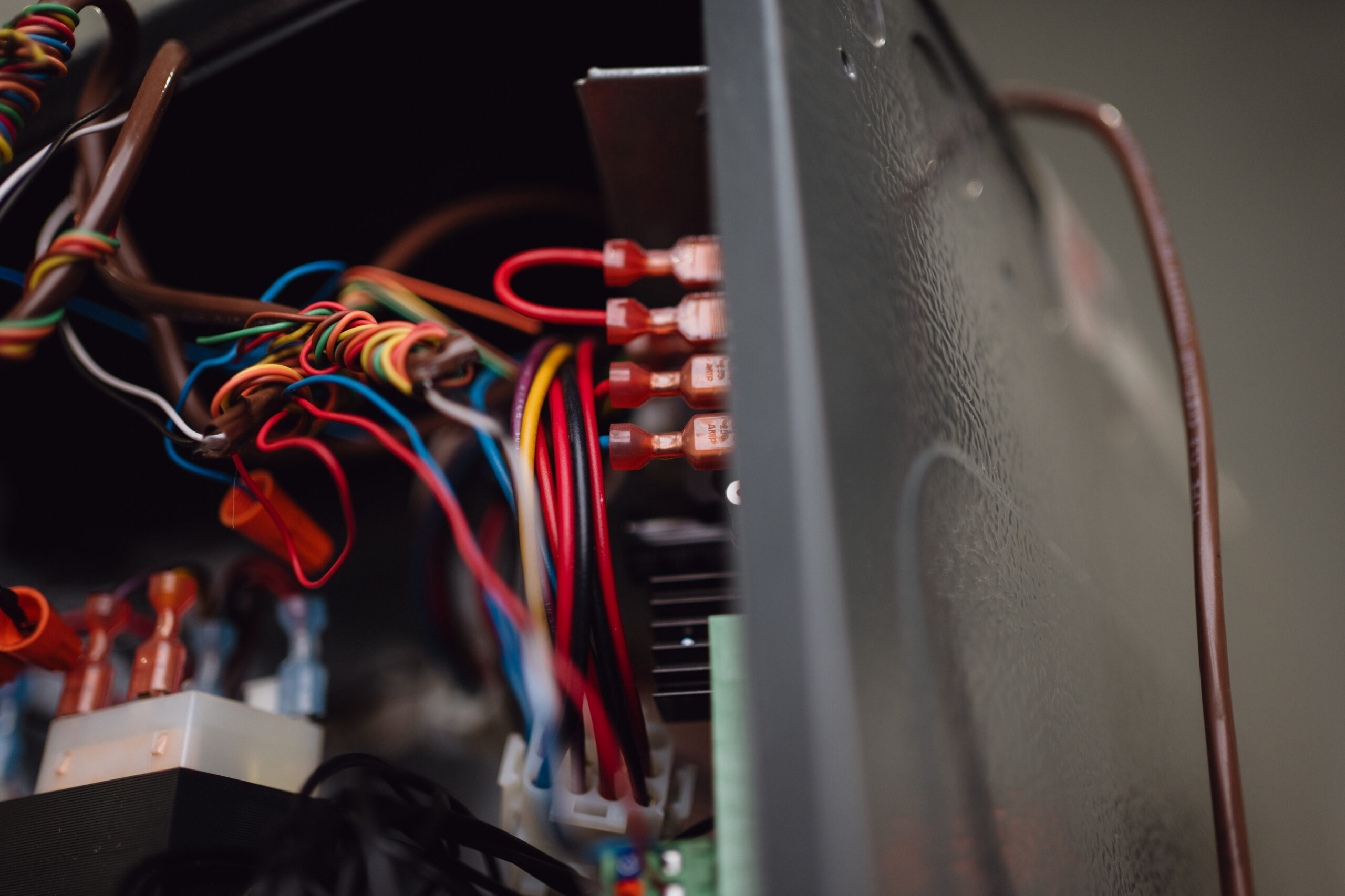 Student working on electrical wiring in San Antonio lab